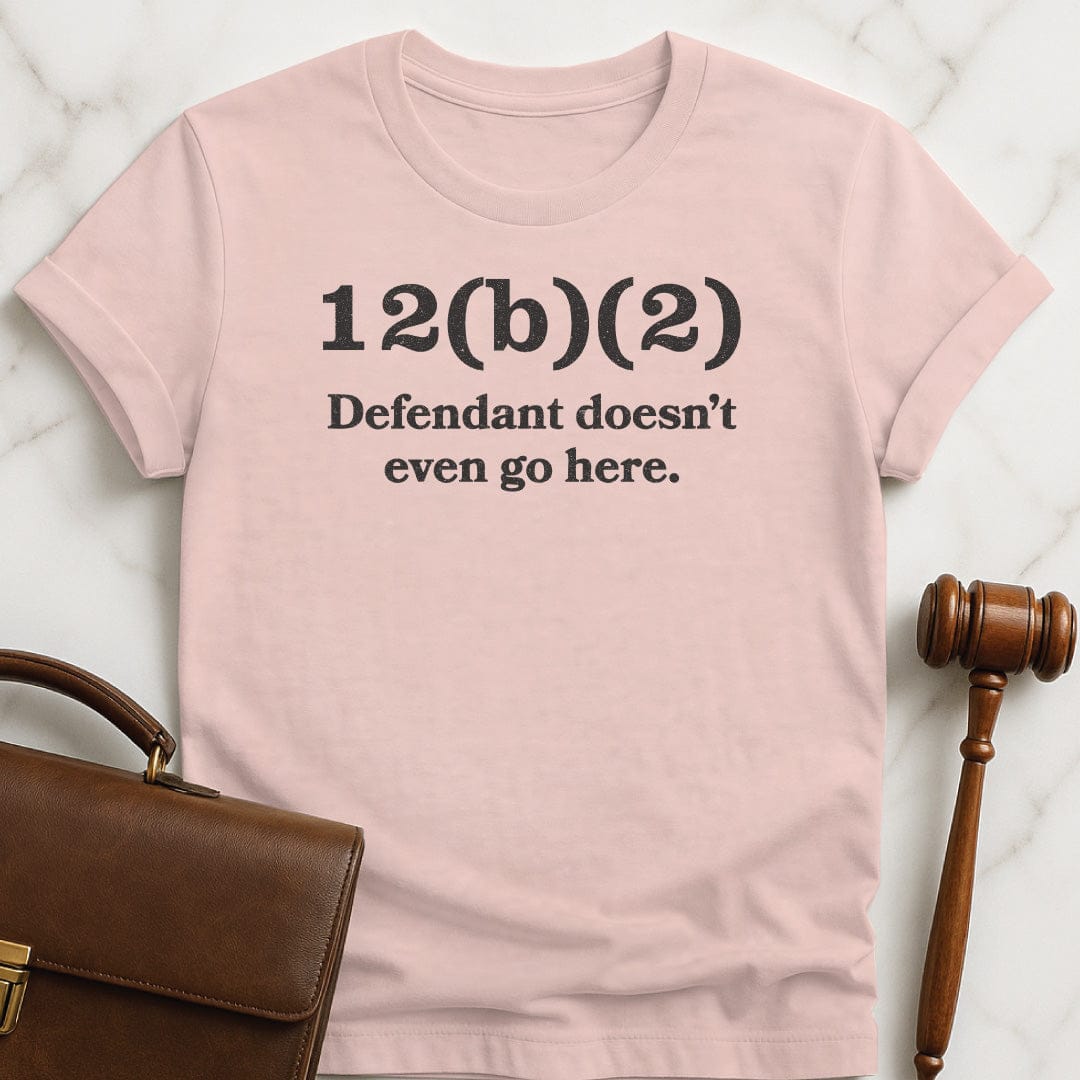 funny new attorney graphic t-shirt that says 12b2 defendant doesnt even go here in pink