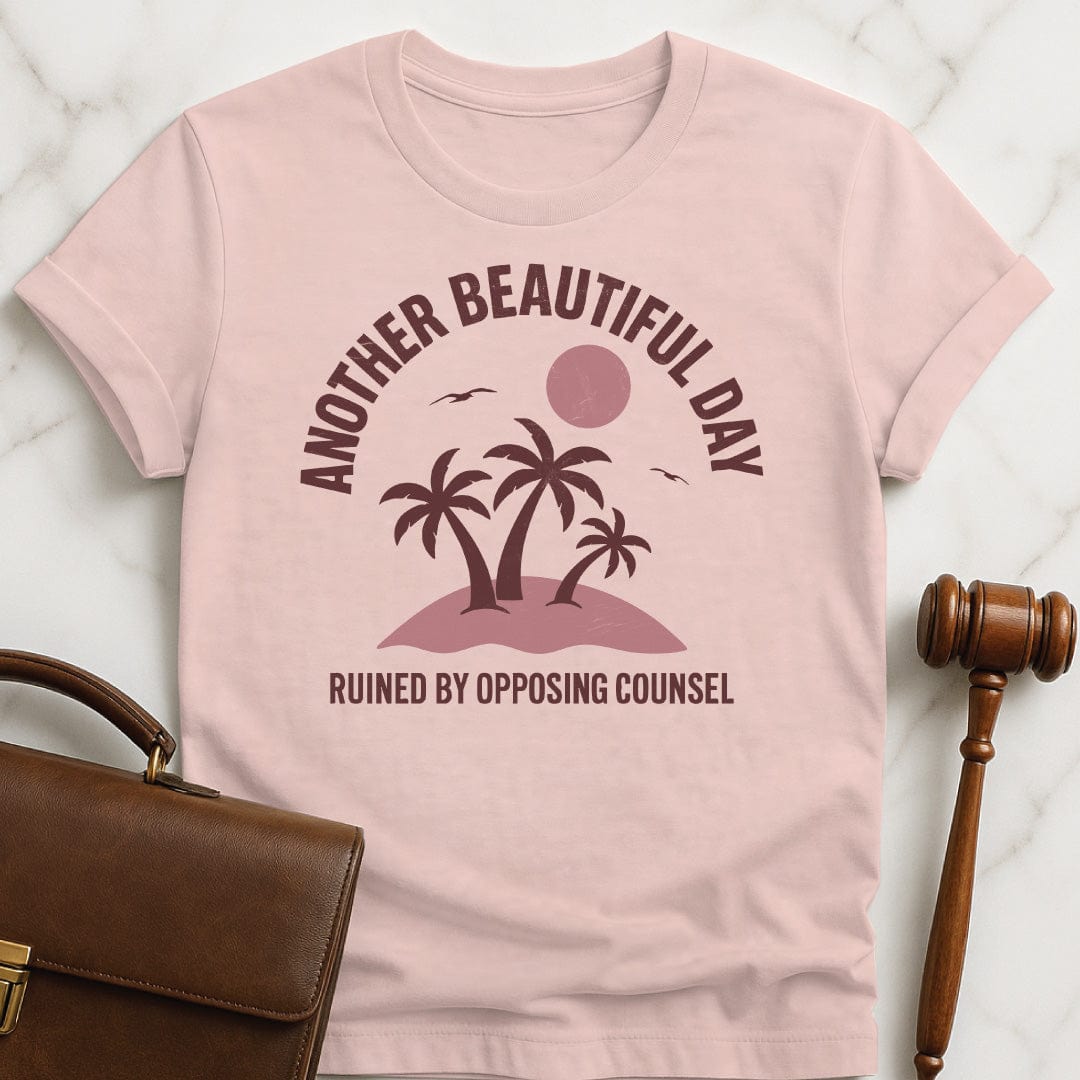 clever lawyer graphic tee that says Another beautiful day ruined by opposing counsel featuring palm trees on a tropical island with sun and birds in pink