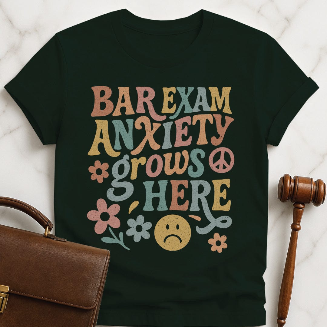funny law school graduate graphic tee that says bar exam anxiety grows here featuring flowers and peace signs in green