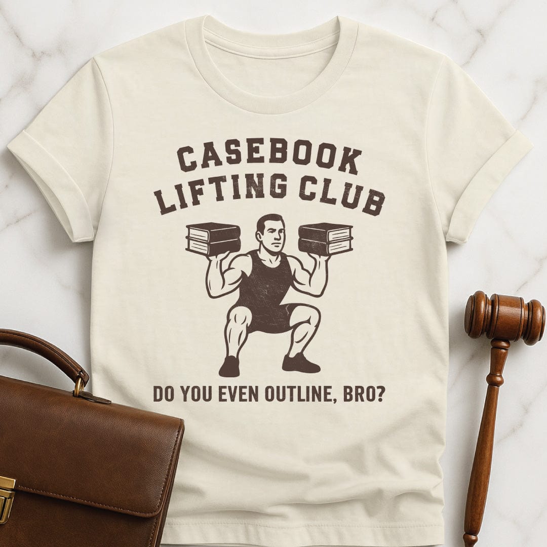 cool law school graphic t shirt that says Casebook Lifting Club Do you even outline bro featuring bodybuilder lifting casebooks in cream