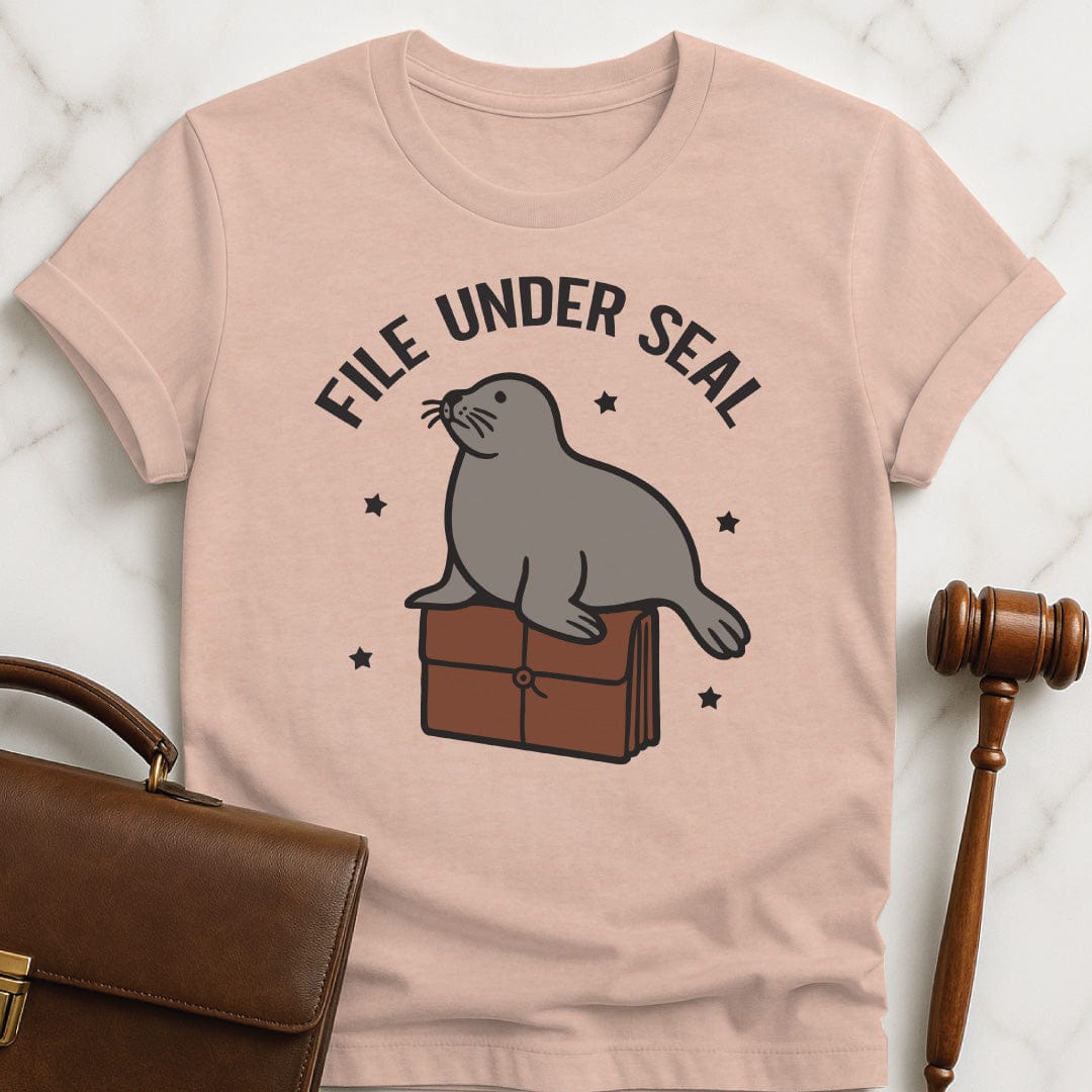 funny lawyer t shirt that says file under seal featuring a seal sitting on top of a redwell in heather peach
