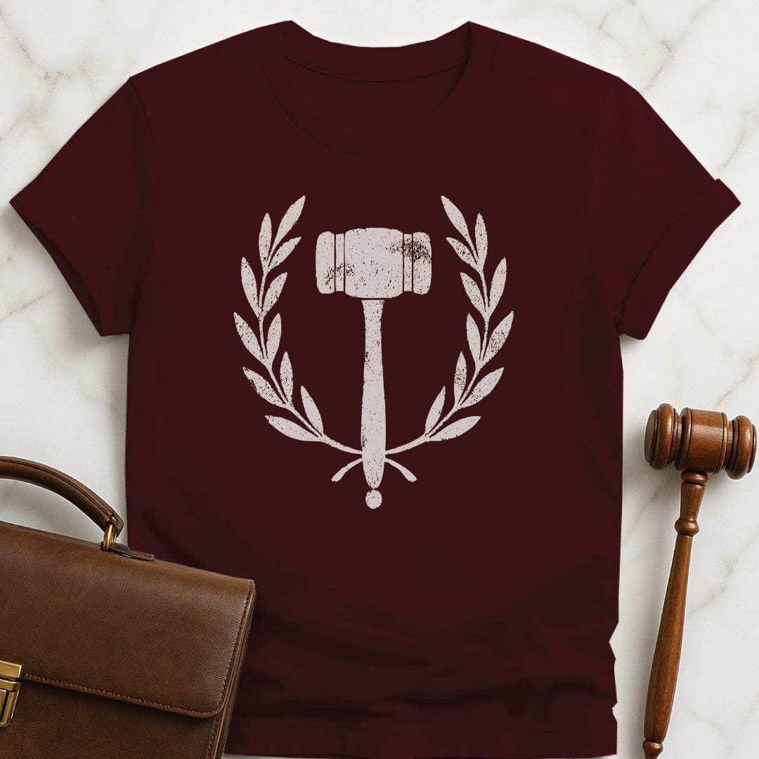 cool law graduate graphic t-shirt featuring gavel inside an ivy crest in brown