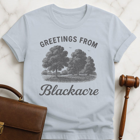 nerdy law grad graphic tee that says greetings from blackacre featuring meadow with trees in blue