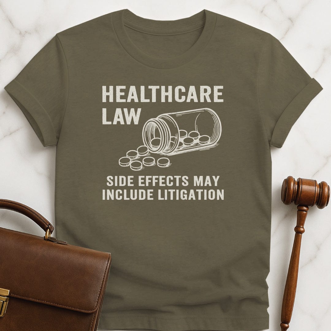 cool law school graphic t shirt that says healthcare law side effects may include litigation featuring open bottle of pills in heather green