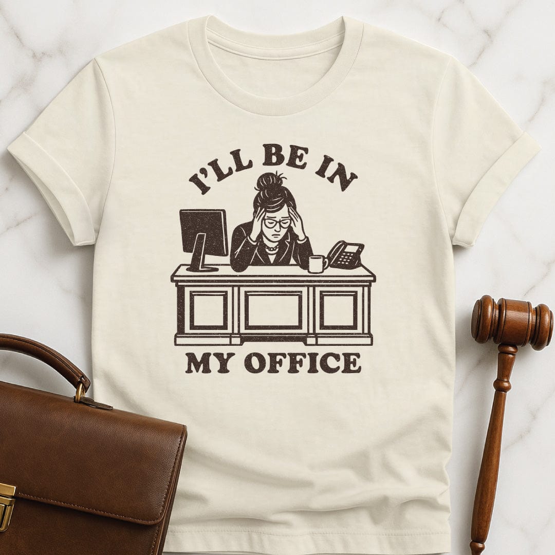 cool law school graduate tee that says Ill be in my office featuring woman lawyer slumped over her desk looking stressed out in cream