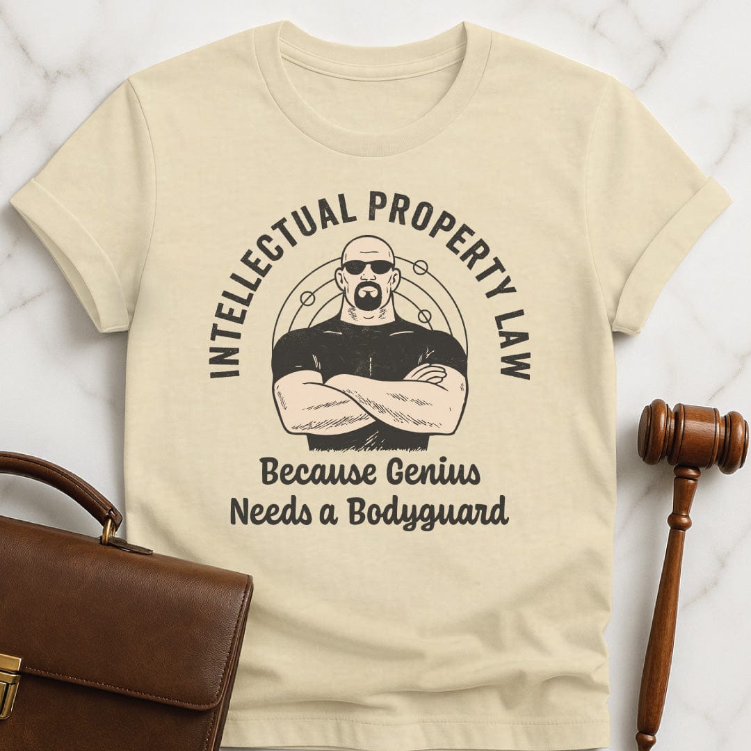 cool law school graduate t shirt that says Intellectual property law because genius needs a bodyguard featuring bodyguard and molecules in cream