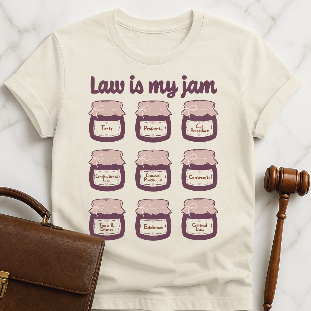 cool law school graduate graphic tee that says law is my jam featuring jars of purple jam saying torts property civil procedure constitutional law criminal procedure contracts trusts and estates evidence criminal law in cream