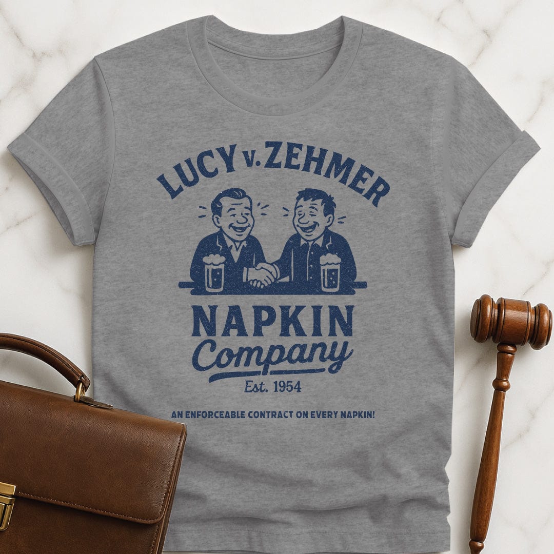 cool law school tee that says Lucy v Zehmer Napkin Company Est 1954 featuring two men drinking beer and shaking hands in grey