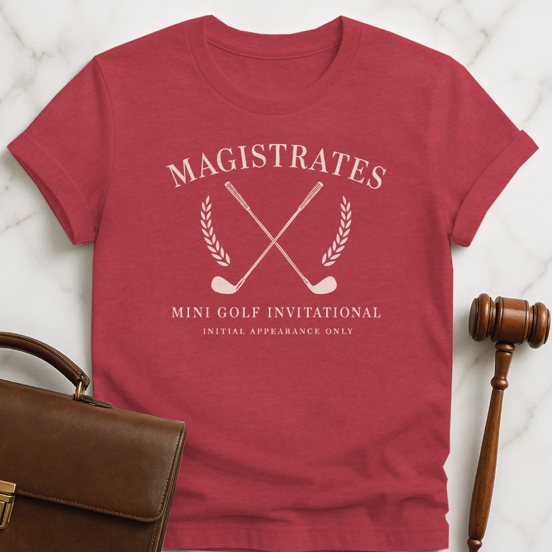 funny attorney graphic t-shirt that says Magistrates Minigolf invitational initial appearances only featuring crest and golf clubs in heather red