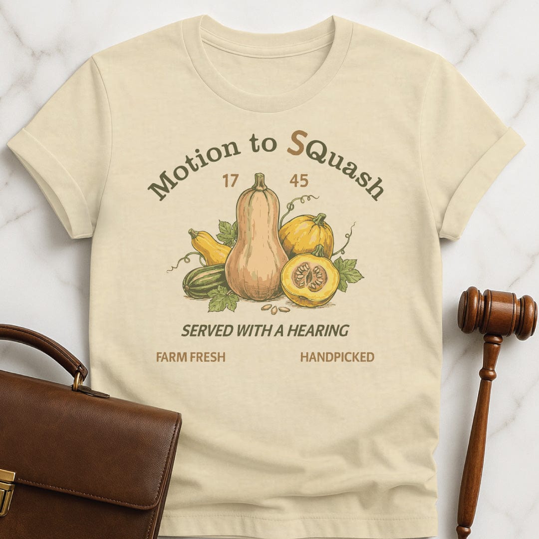 cute law grad graphic t shirt that says Motion to quash with s added in featuring squash in cream