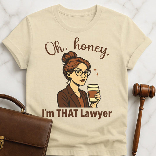 funny law graduate tee that says Oh honey im that lawyer featuring a white woman with glasses and a grey suit in cream