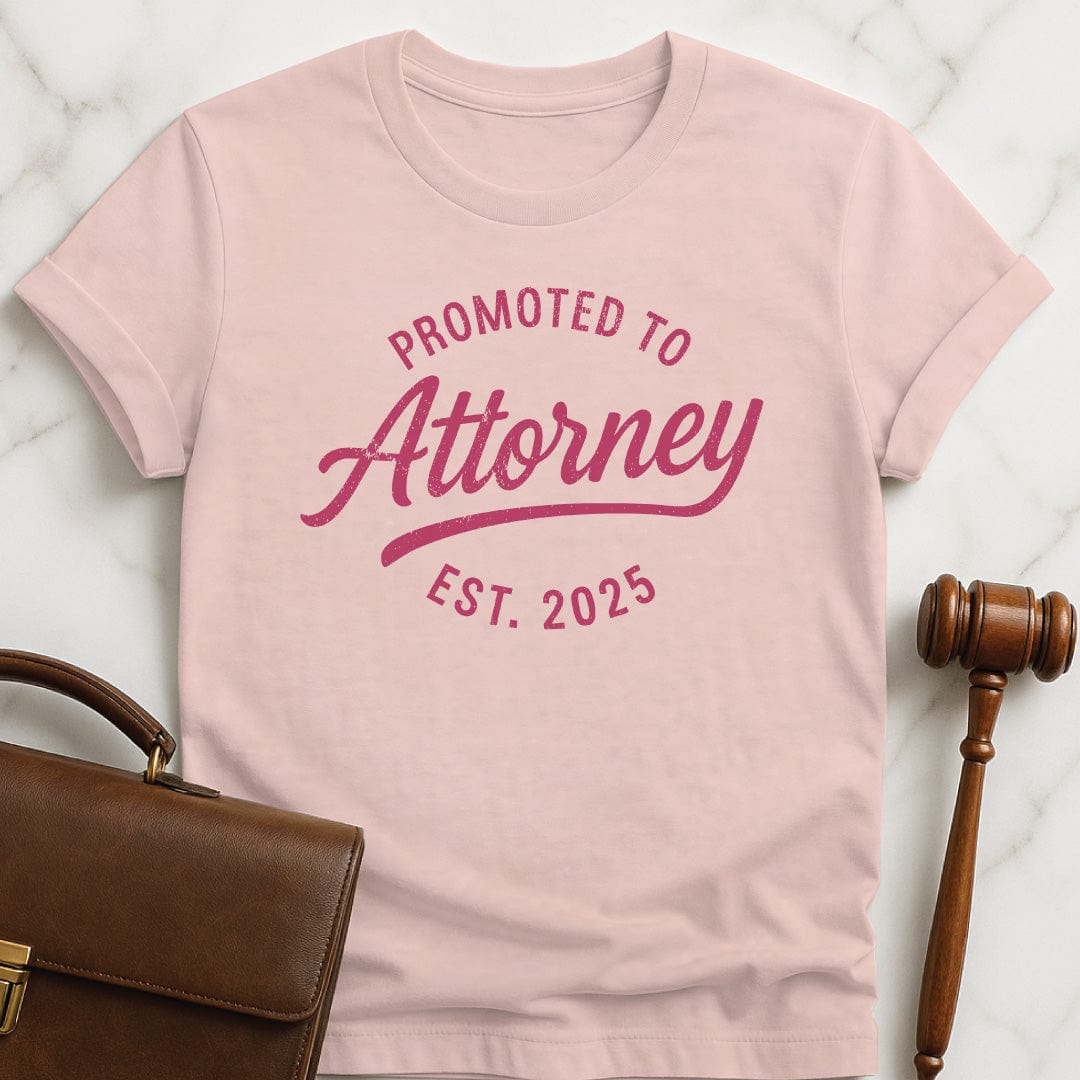 cute law school graduate graphic tee that says Promoted to Attorney Established 2025 in pink
