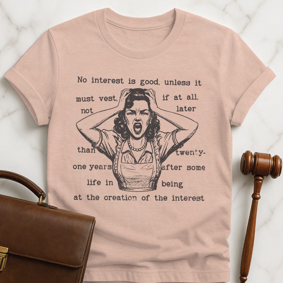 cool new lawyer graphic t shirt that says rule against perpetuities No interest is good featuring a woman panicking in heather peach