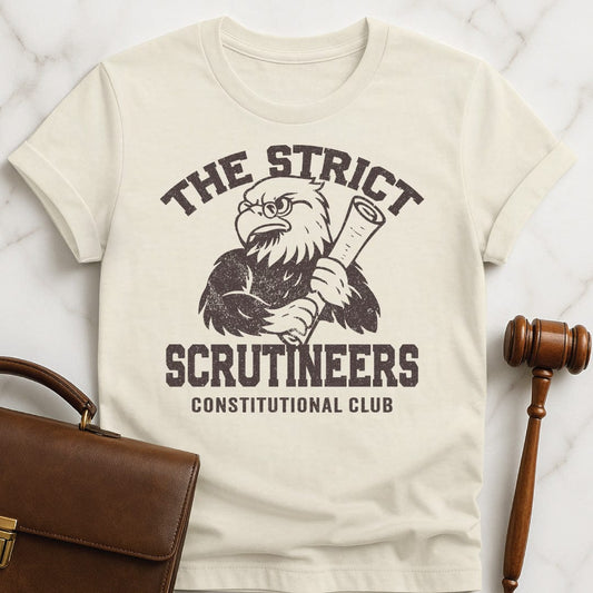 cool law school graphic tee that says strict scrutineers featuring an eagle holding a scroll in cream