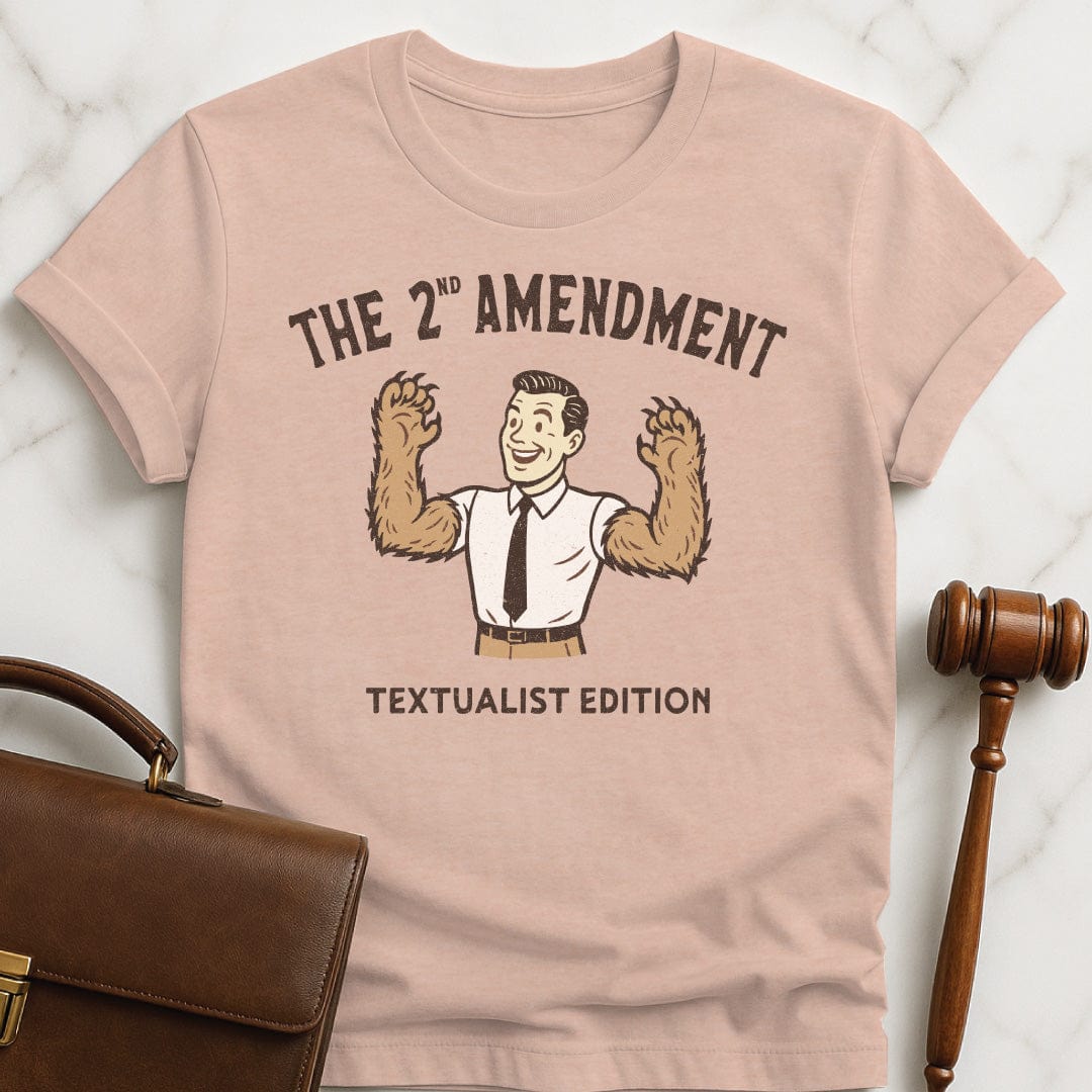 cute new lawyer graphic t shirt that says The second amendment textualist edition featuring a man with bears arms in heather peach