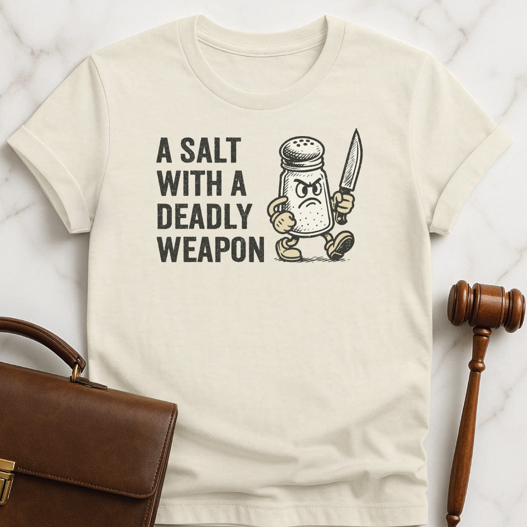 funny new attorney tshirt that says A Salt with a Deadly Weapon featuring salt shaker with a knife in cream
