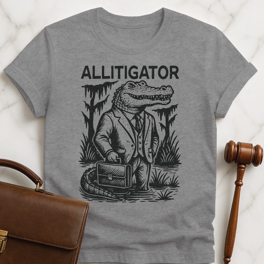 funny law school grad t-shirt that says allitigator featuring an alligator holding a briefcase in a swamp in grey