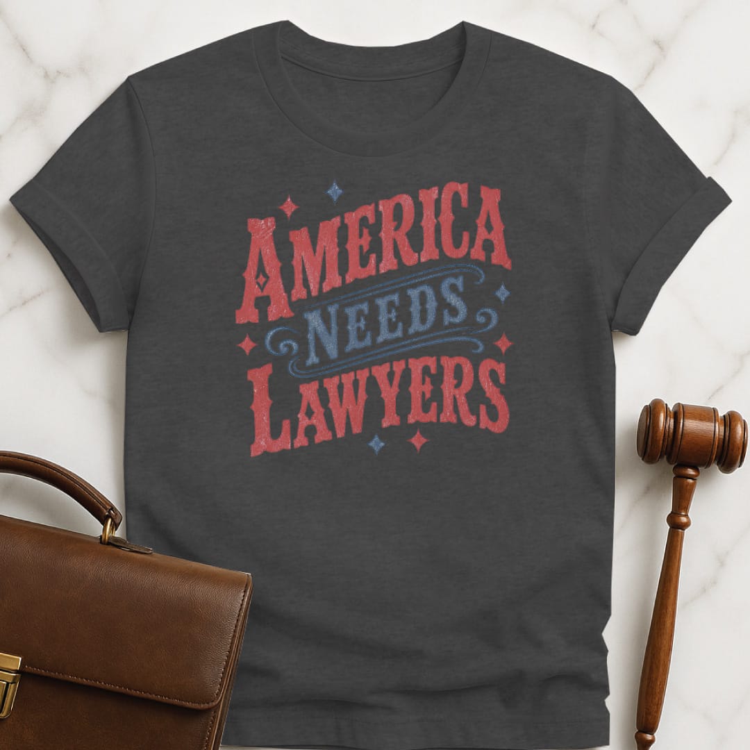 fun law graduate tee that says America needs lawyers featuring red and blue western font and stars in grey