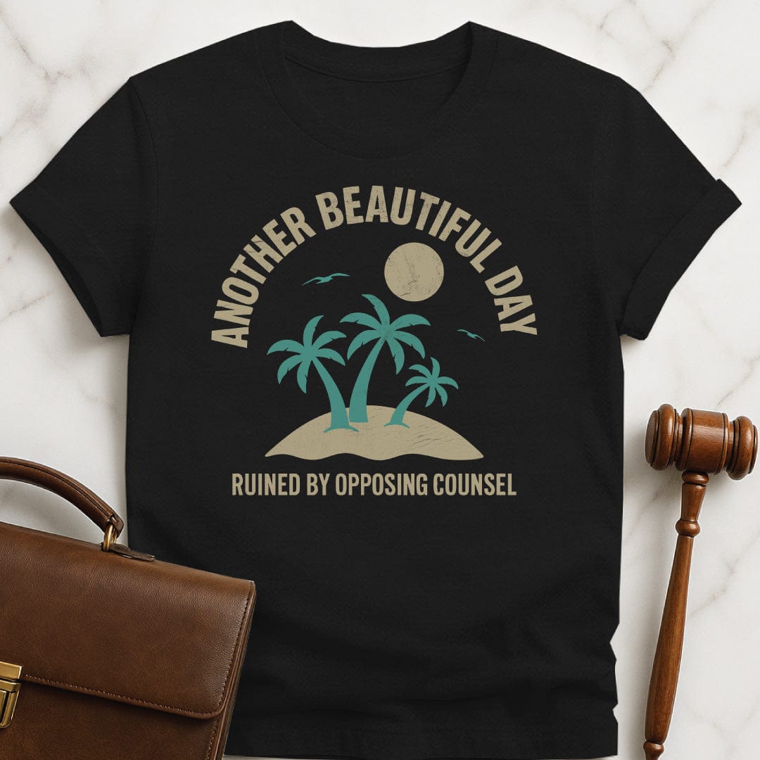 clever law grad t shirt that says Another beautiful day ruined by opposing counsel featuring palm trees on a tropical island with sun and birds in black