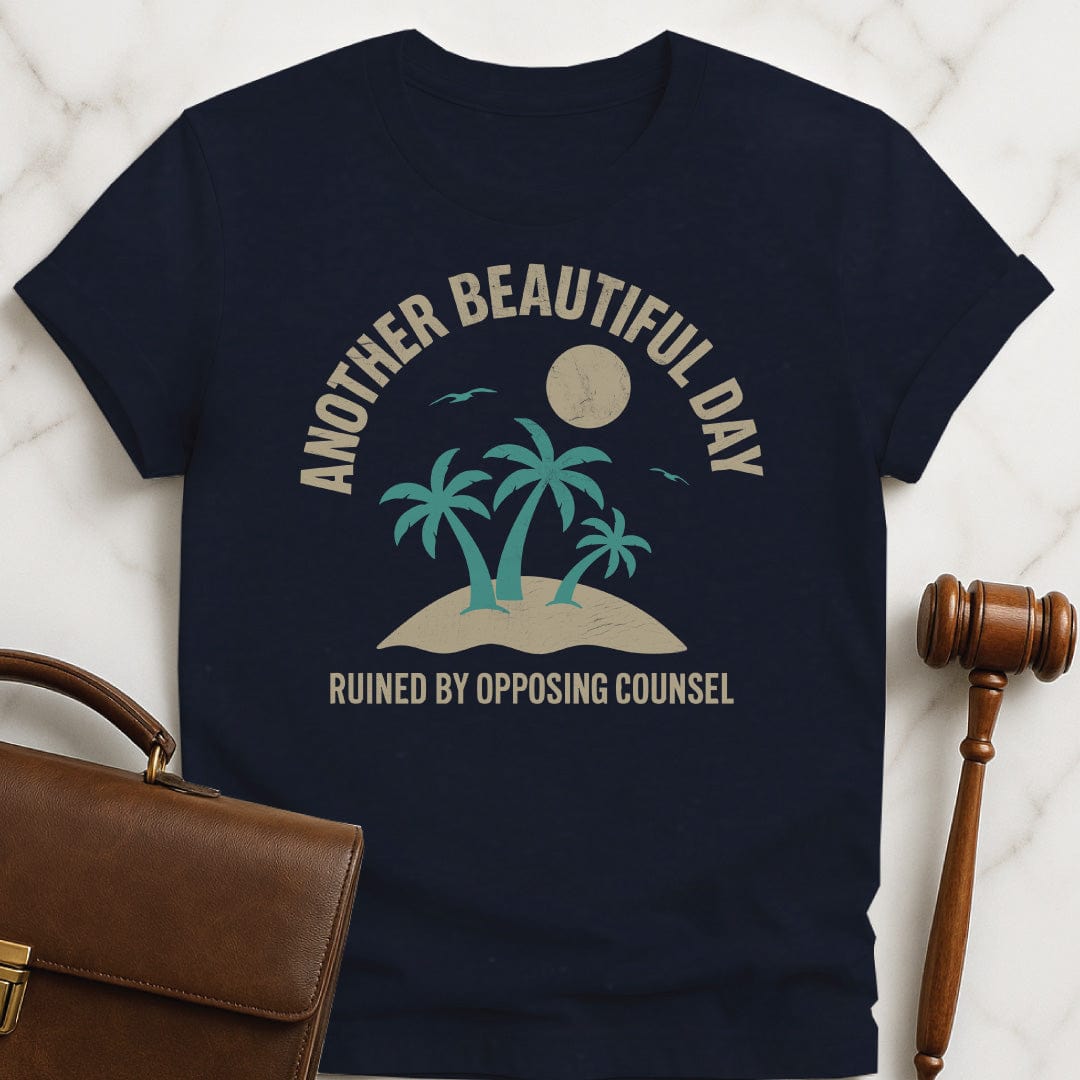 clever new lawyer graphic t shirt that says Another beautiful day ruined by opposing counsel featuring palm trees on a tropical island with sun and birds in blue