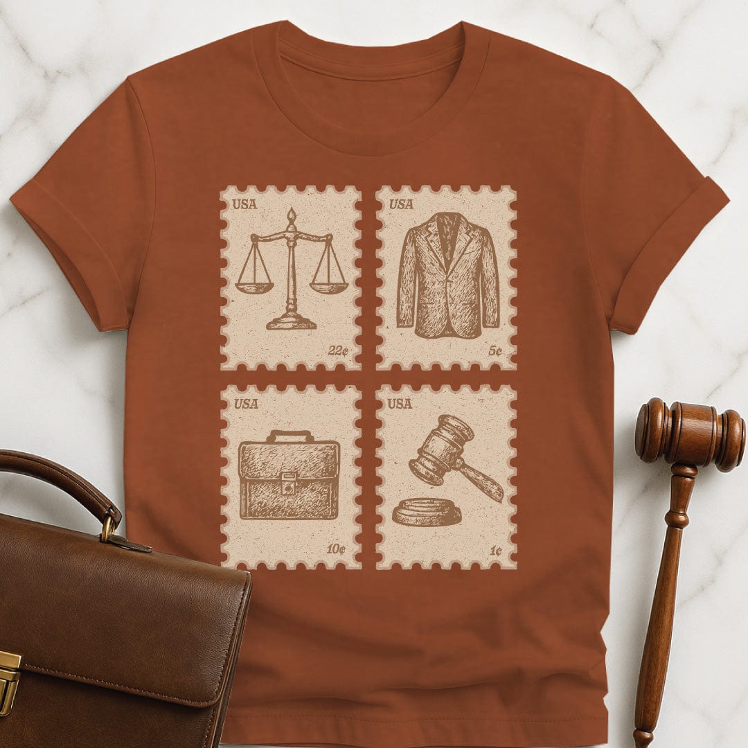 cute law school graduate graphic tee featuring antique vintage style stamps of brief case scales of justice gavel and a suit jacket in brown