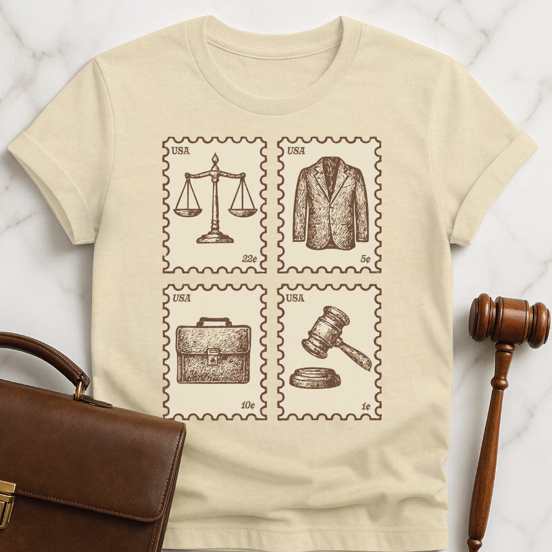 cool law student graphic tshirt featuring antique vintage style stamps of brief case scales of justice gavel and a suit jacket in cream