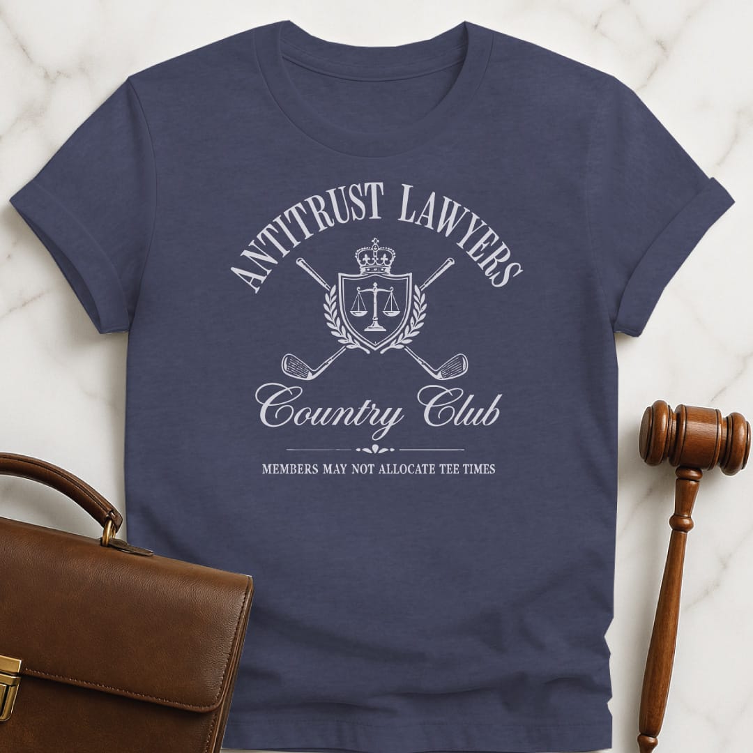 cool attorney tee that says Antitrust lawyers country club members may not allocate tee times featuring golf clubs in a crest in heather blue