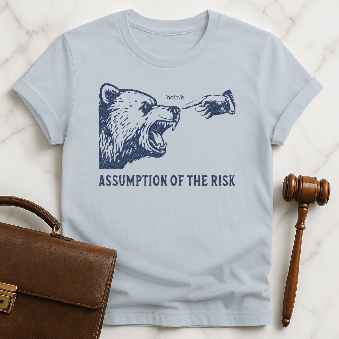 funny law school grad graphic tshirt that says Assumption of the risk featuring a hand about to tap a growling bear on the nose and the text boink in blue