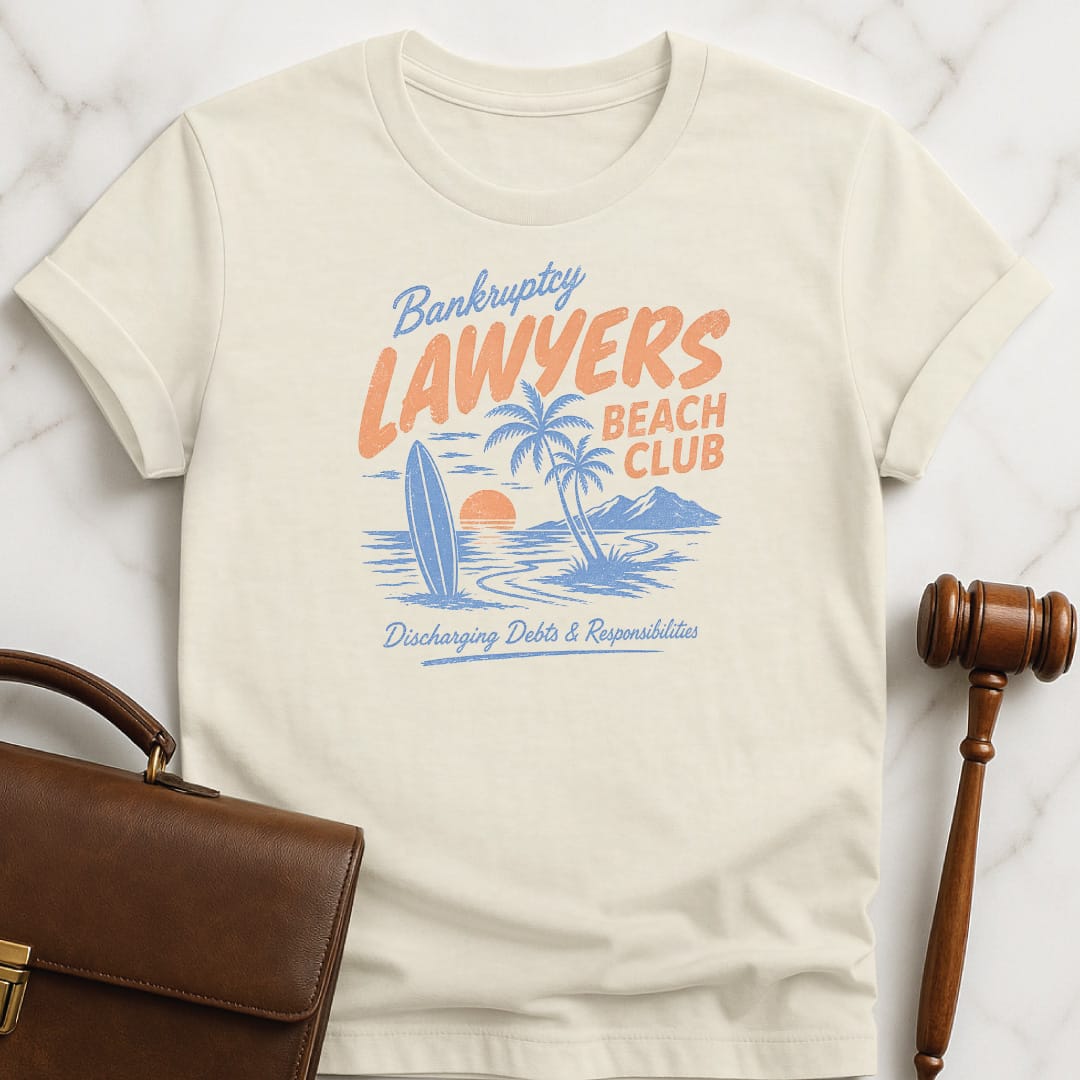 funny new lawyer t-shirt that says bankruptcy lawyers beach club discharging debts and responsibilities featuring beach scene in cream