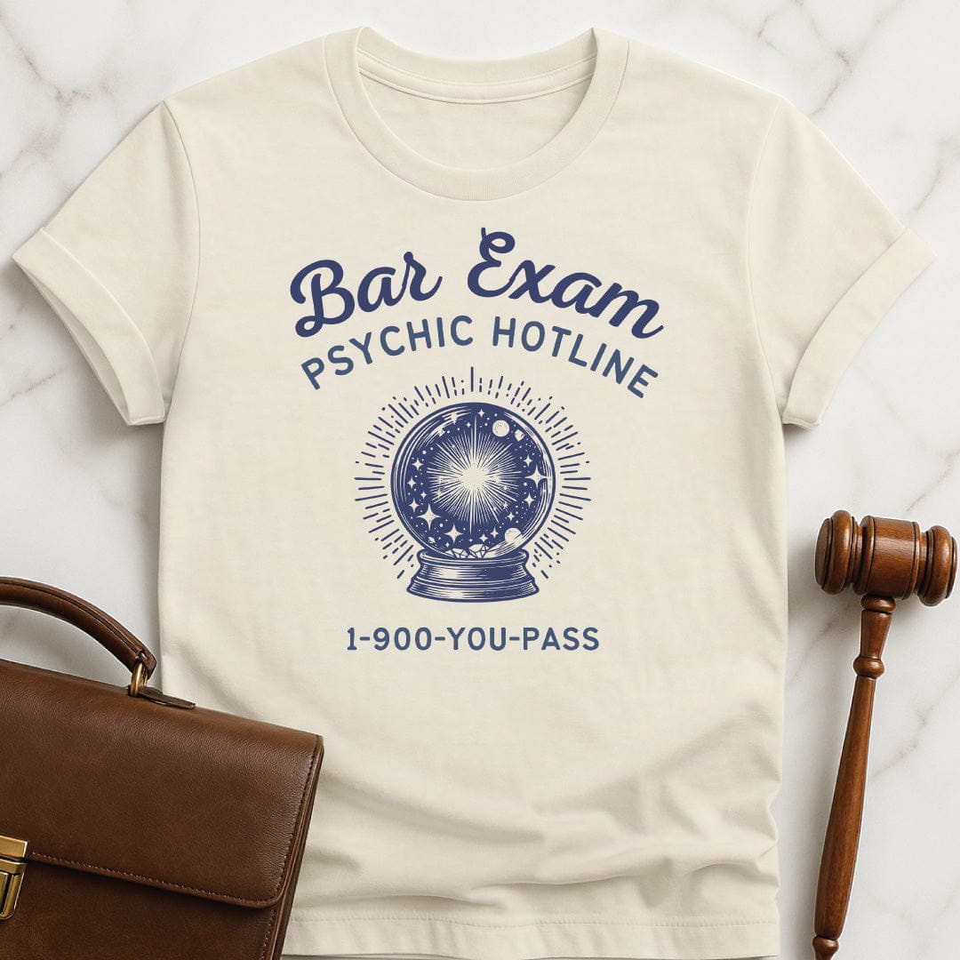 funny law school grad t-shirt that says Bar Exam Psychic Hotline 1 900 You Pass featuring crystal ball in cream