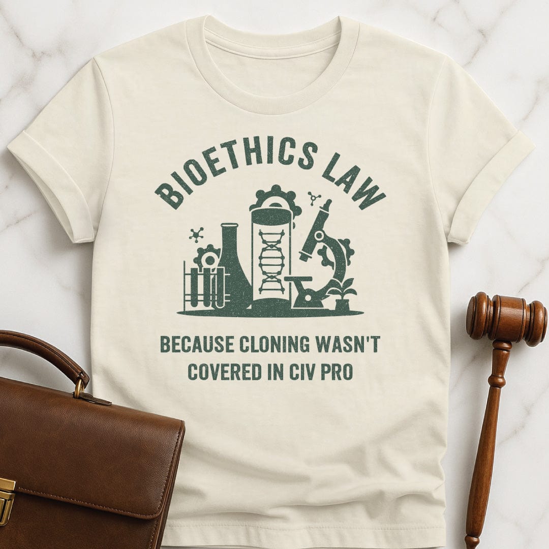 funny law graduate graphic t-shirt that says Bioethics law because cloning wasnt covered in civ pro featuring a science lab in cream