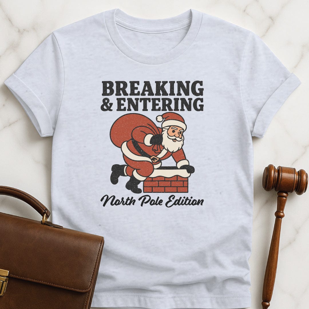 christmas law school grad graphic tshirt that says Breaking and entering North Pole edition featuring Santa Claus going down a chimney in grey