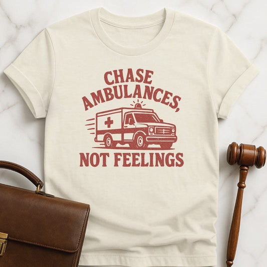 funny attorney graphic tshirt that says Chase ambulances not feelings featuring red ambulance in cream