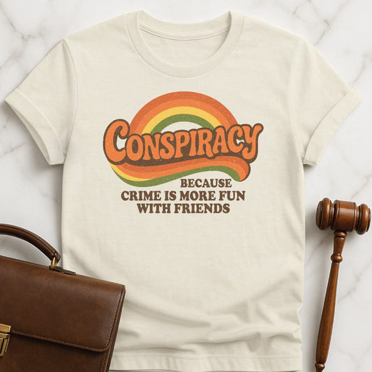 funny law school graduate t shirt that says Conspiracy because crime is more fun with friends featuring 70s retro vibe in cream