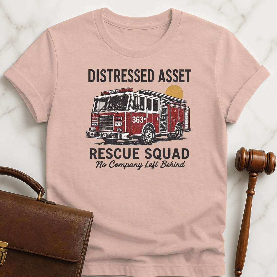 cool lawyer graphic tee that says distressed asset rescue squad 363 no company left behind featuring firetruck in heather peach