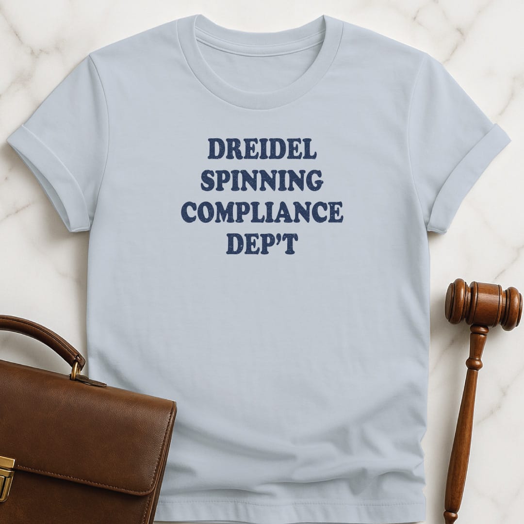 hanukkah attorney graphic t-shirt that says Dreidel Spinning Compliance Department in blue