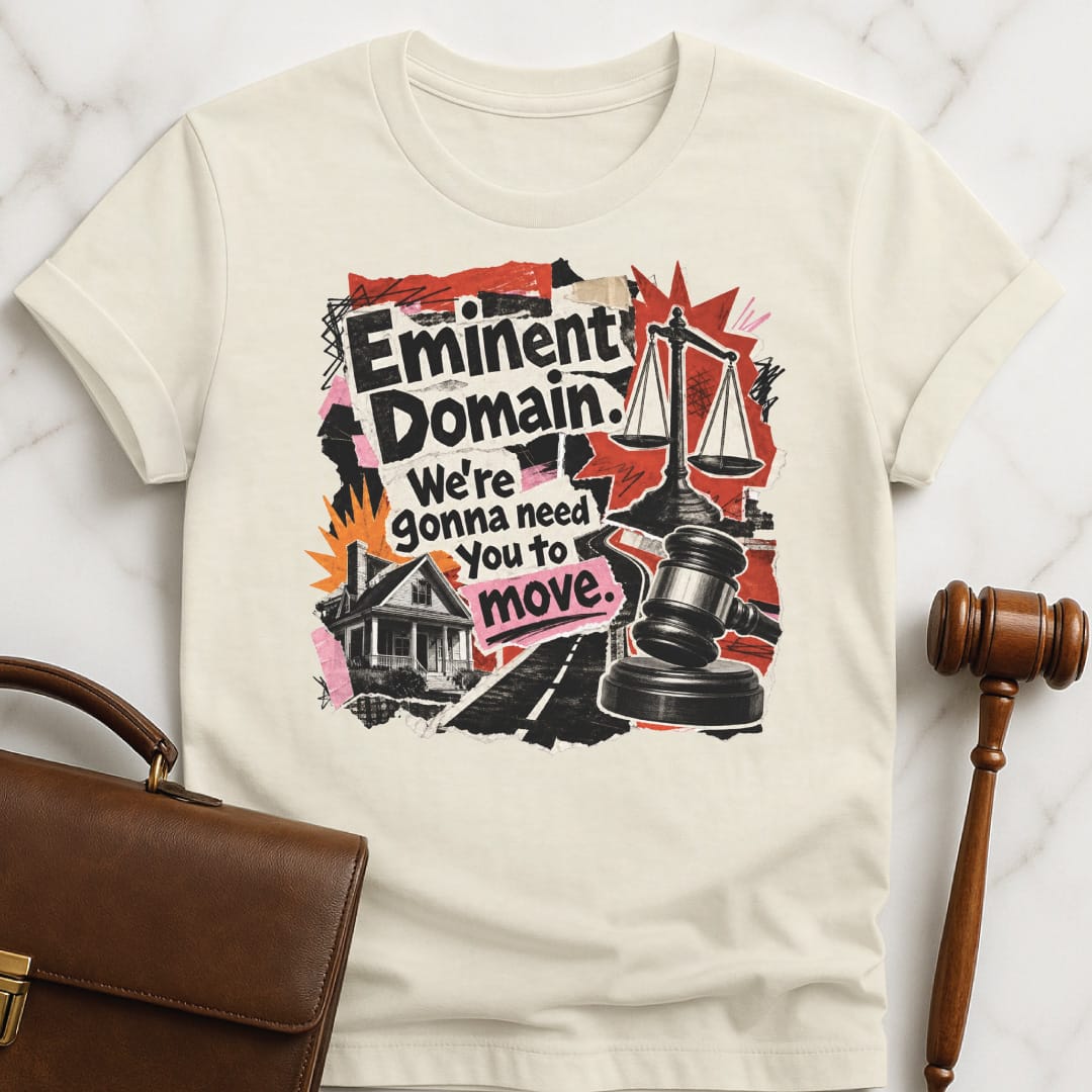 cool law school grad graphic t shirt that says Eminent domain were going to need you to move featuring cutouts of scales of justice police car house road in cream
