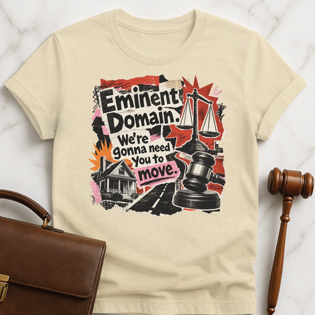 funny law school graduate graphic tshirt that says Eminent domain were going to need you to move featuring cutouts of scales of justice police car house road in cream