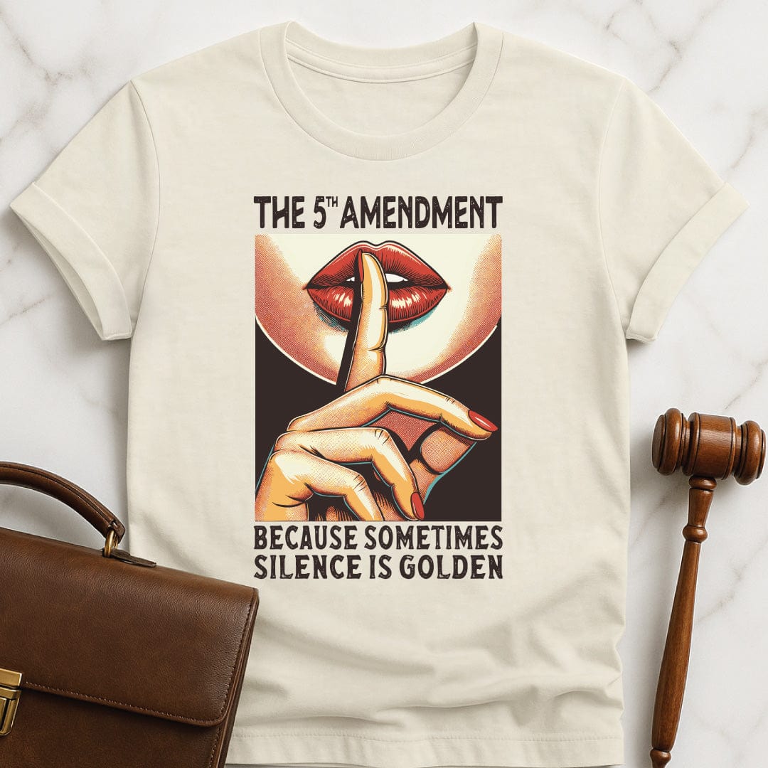funny law school grad graphic tshirt that says fifth amendment because sometimes silence is golden featuring a woman gesturing shh with her fingers to her lips in cream