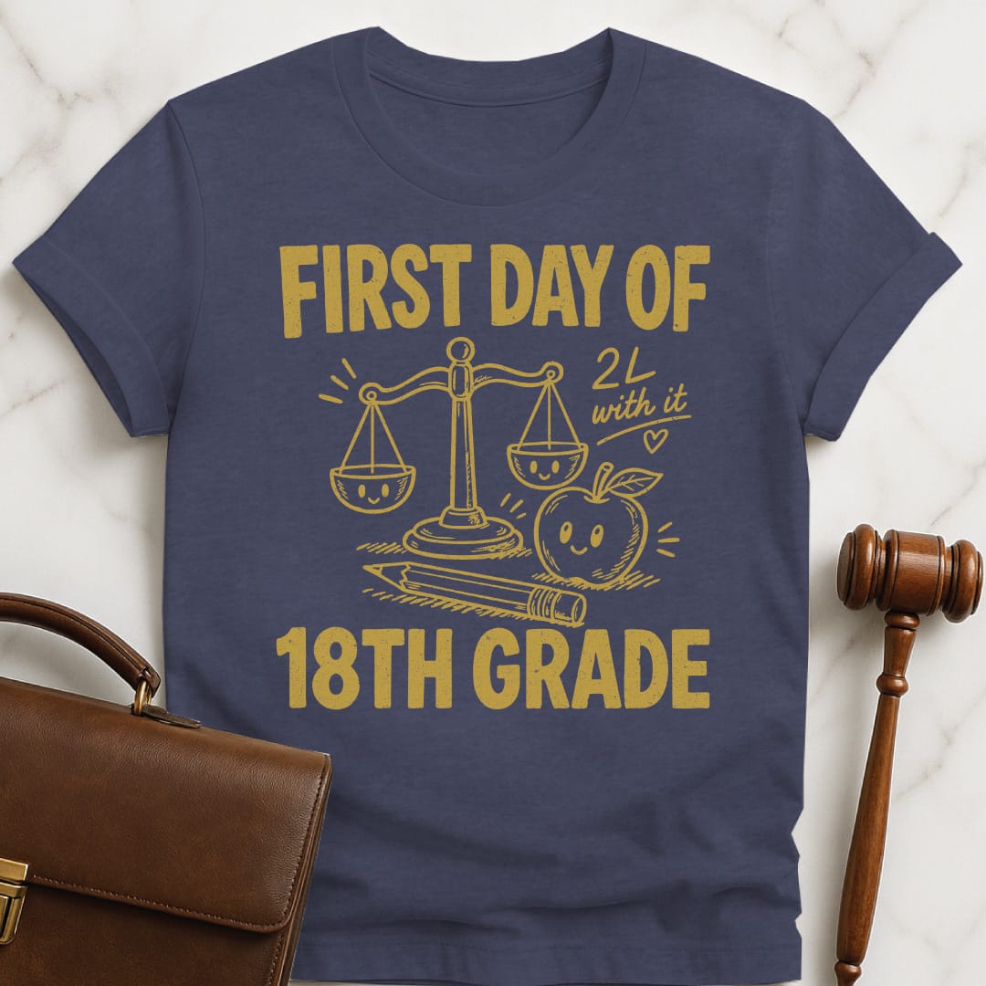 funny law school t-shirt that says First Day of 18th Grade 2L with it featuring apple scales of justice pencil and a heart in heather blue