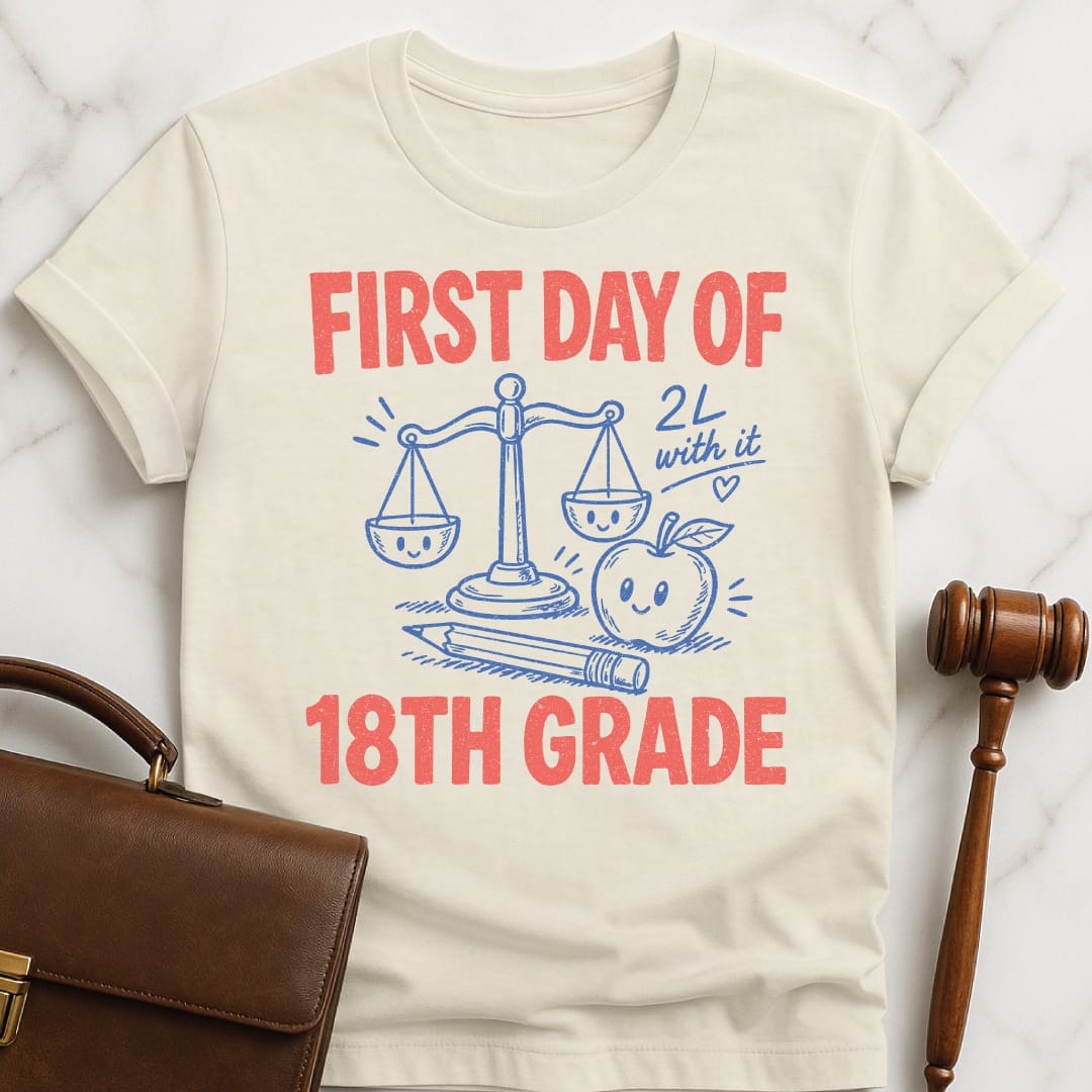 retro law student t shirt that says First Day of 18th Grade 2L with it featuring apple scales of justice pencil and a heart in cream