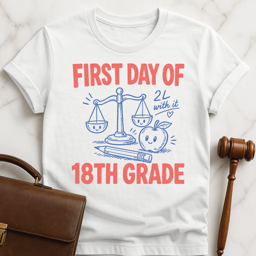 retro law student tee that says First Day of 18th Grade 2L with it featuring apple scales of justice pencil and a heart in white