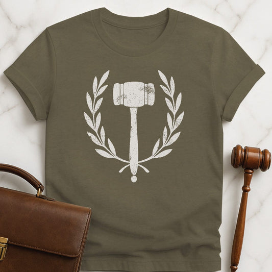 cool law graduate graphic tshirt featuring gavel inside an ivy crest in heather green