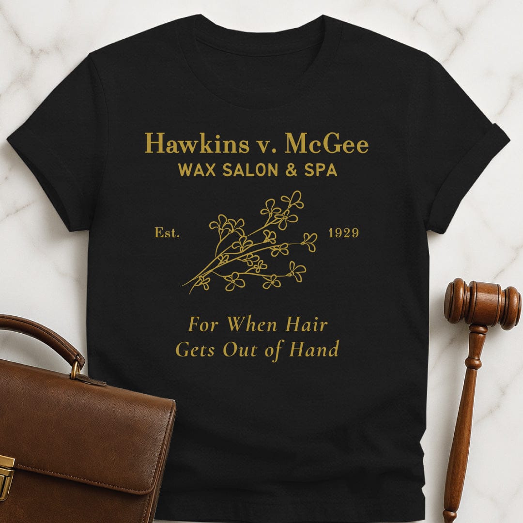 funny law graduate graphic t-shirt that says hawkins v mcgee wax salon and spa featuring branch of flowers in black