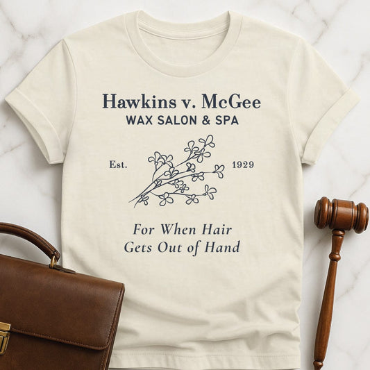 funny new attorney tshirt that says hawkins v mcgee wax salon and spa featuring branch of flowers in cream