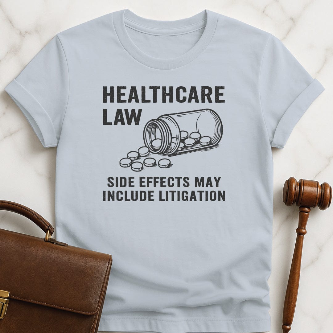 funny new attorney graphic t-shirt that says healthcare law side effects may include litigation featuring open bottle of pills in blue