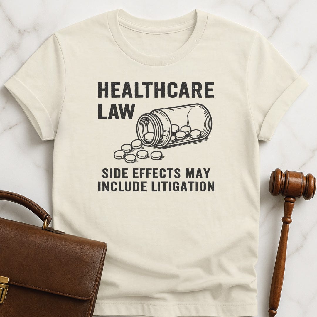 funny law student graphic tshirt that says healthcare law side effects may include litigation featuring open bottle of pills in cream