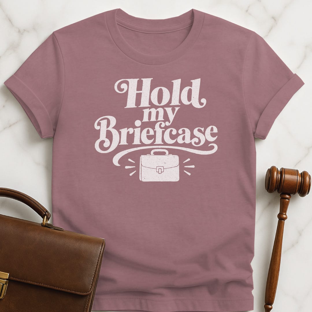 cool attorney graphic tee that says Hold my briefcase featuring briefcase and flourishes in heather mauve