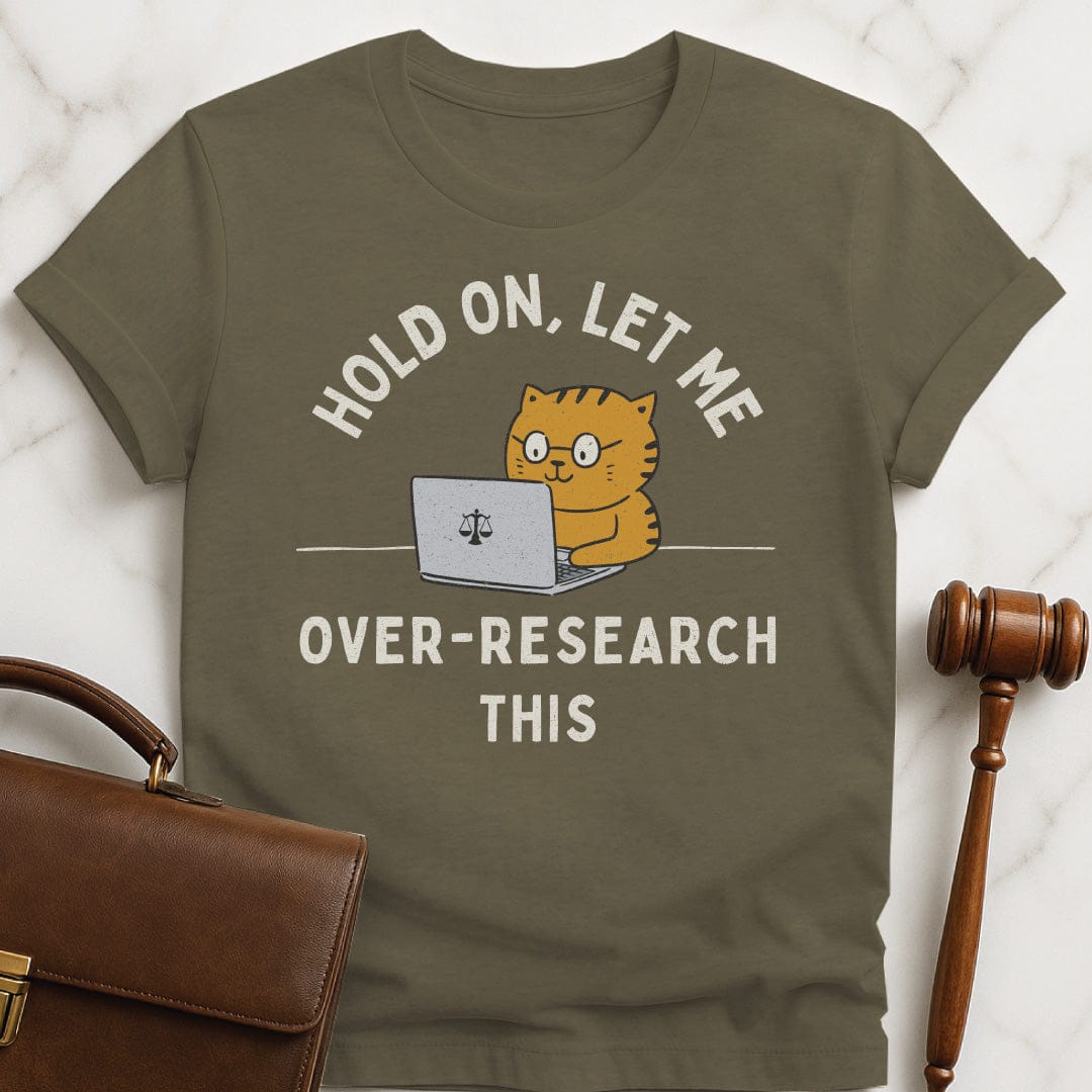 funny new attorney tshirt that says Hold On let me over research this featuring cat using a laptop with a scales of justice in heather green