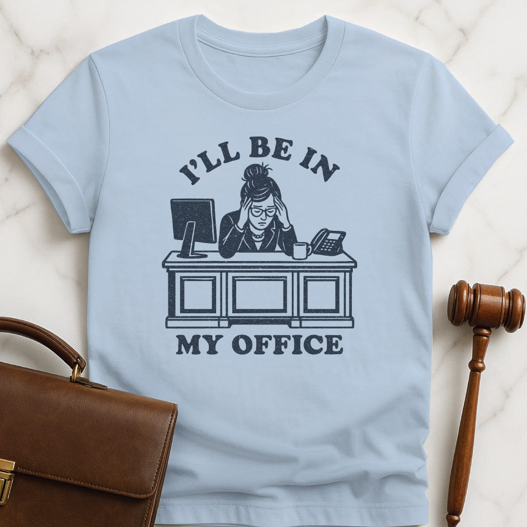funny new attorney tshirt that says Ill be in my office featuring woman lawyer slumped over her desk looking stressed out in blue